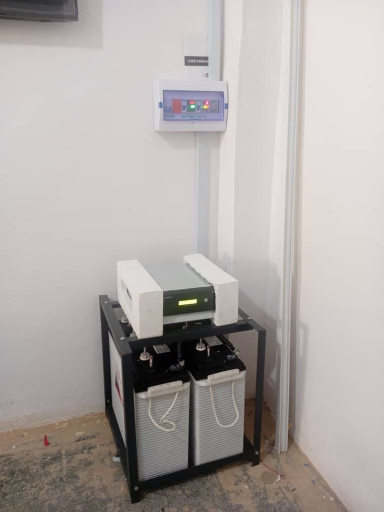 Modern residential solar panel installation on a tile roof.