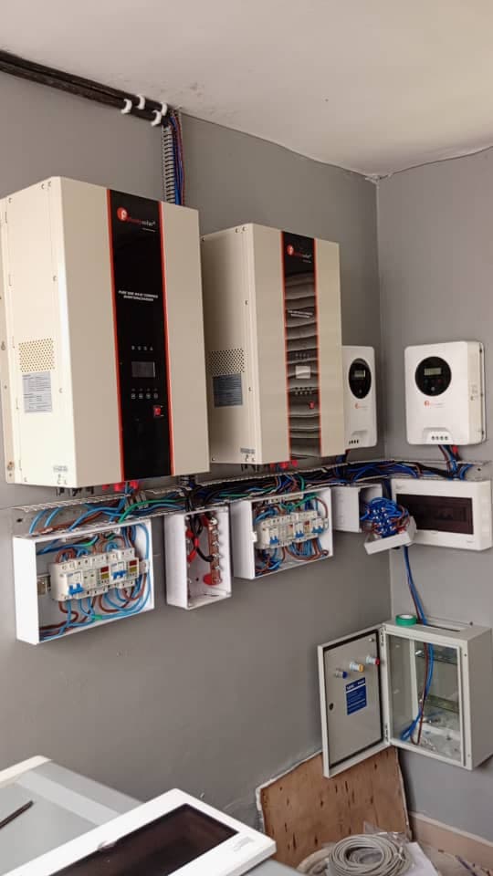 Ground-mounted solar panels in a rural setting.